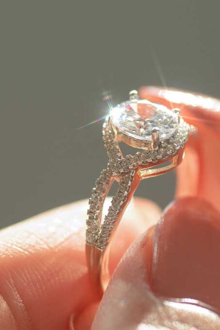 close-up-view-of-a-diamond-ring-and-woman-hand-5F7KC8H.jpg